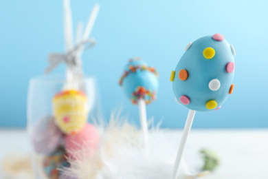 Photo of Closeup view of delicious sweet cake pop, space for text. Easter holiday
