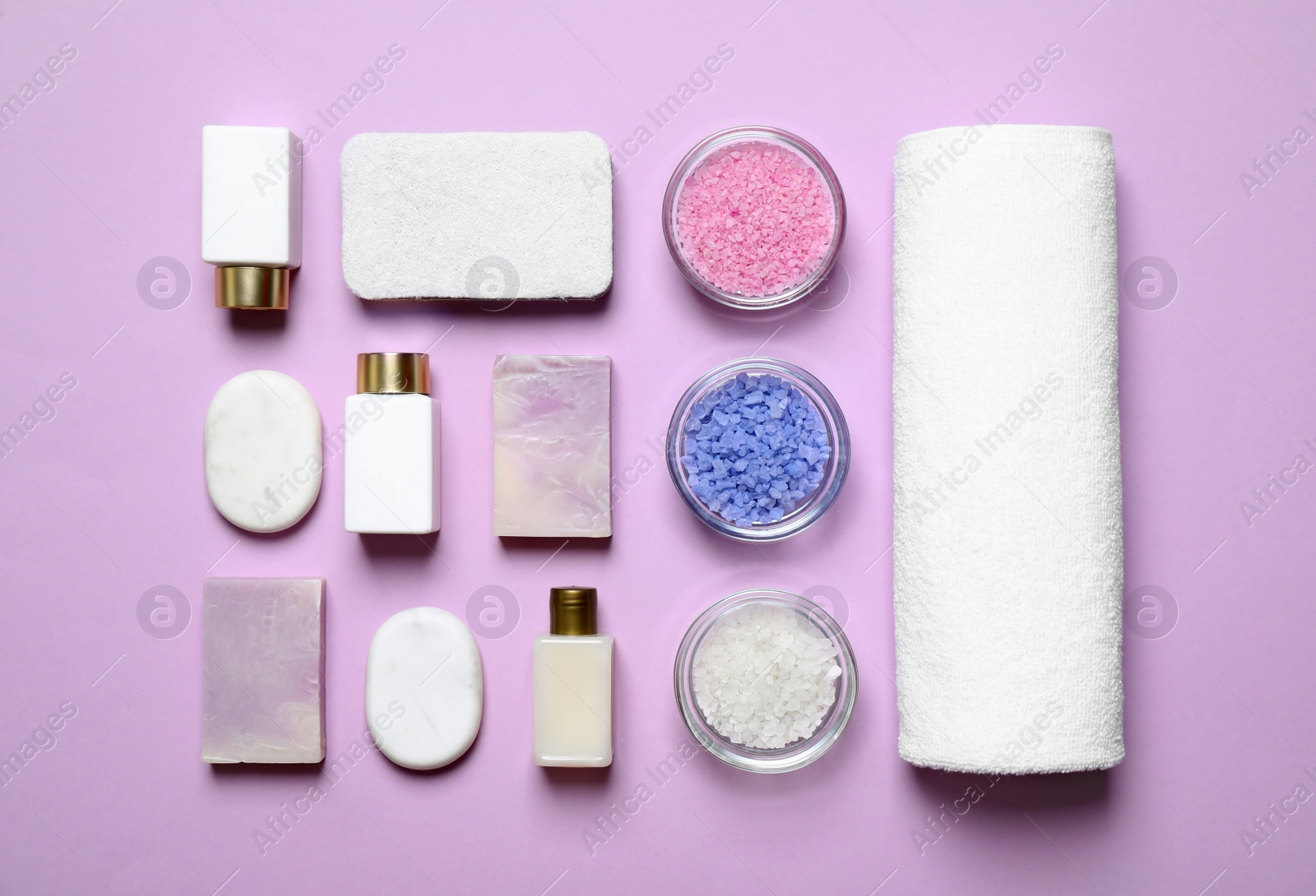 Photo of Flat lay composition with cosmetic products on lilac background