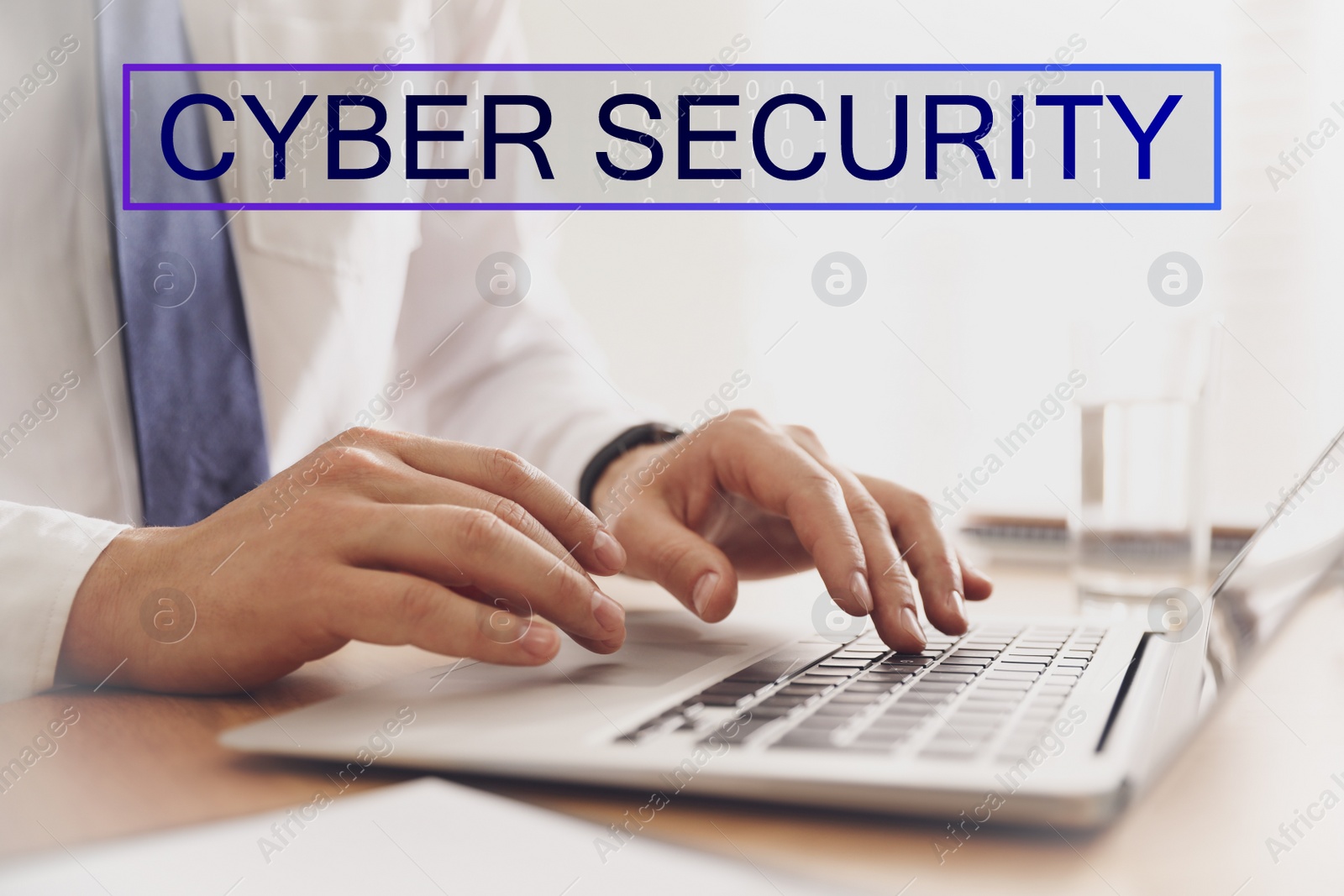 Image of Cyber security concept. Man working with laptop at table indoors, closeup