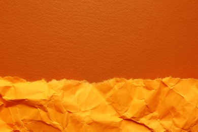 Photo of Orange textured materials as background, closeup view