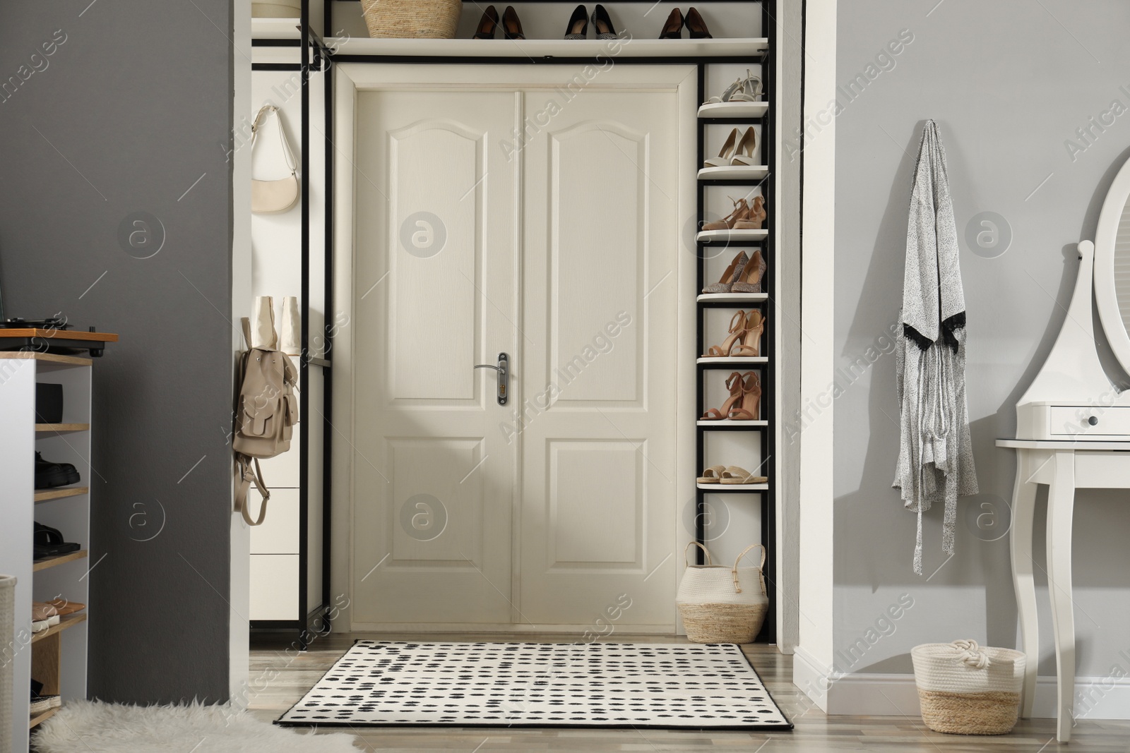 Photo of Dressing room interior with storage rack for shoes and accessories