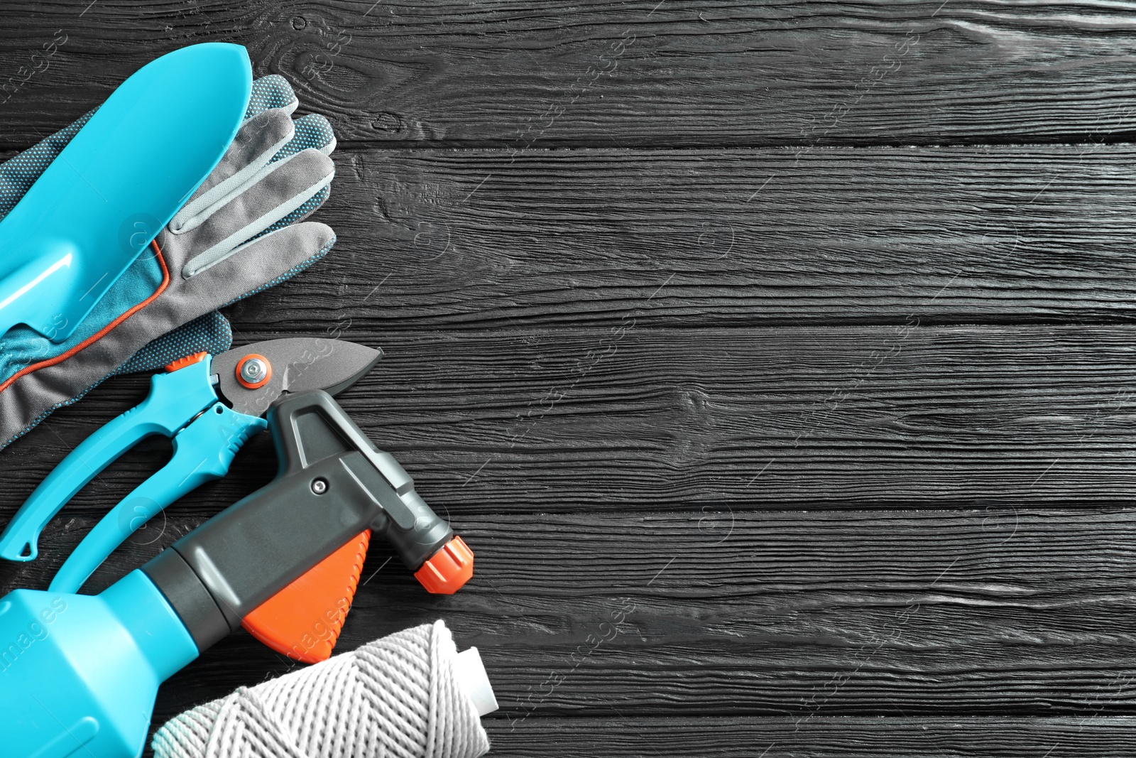 Photo of Flat lay composition with gardening tools on wooden background