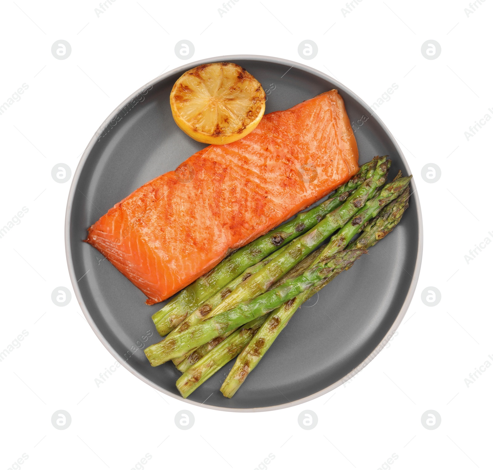 Photo of Tasty grilled salmon with asparagus and lemon isolated on white, top view