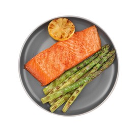 Photo of Tasty grilled salmon with asparagus and lemon isolated on white, top view