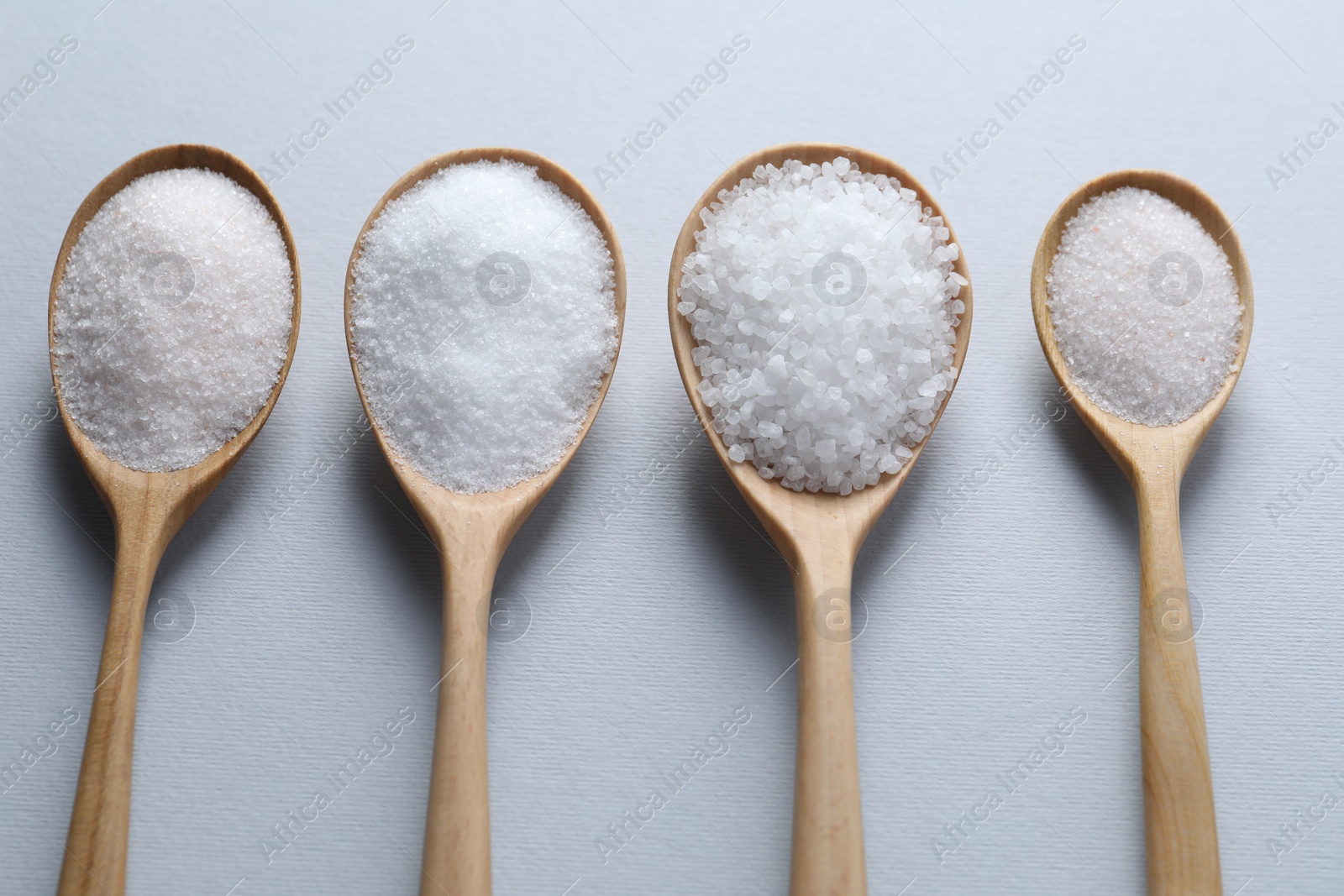 Photo of Organic white salt on light grey background