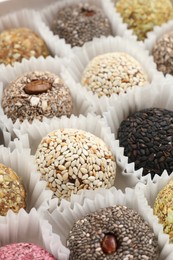 Photo of Assortment of different delicious vegan candy balls, closeup