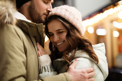 Lovely couple on city street. Winter vacation