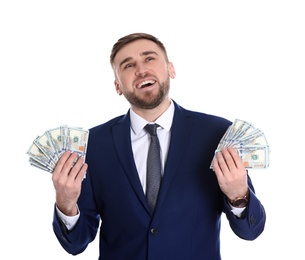 Portrait of young businessman holding money banknotes on white background