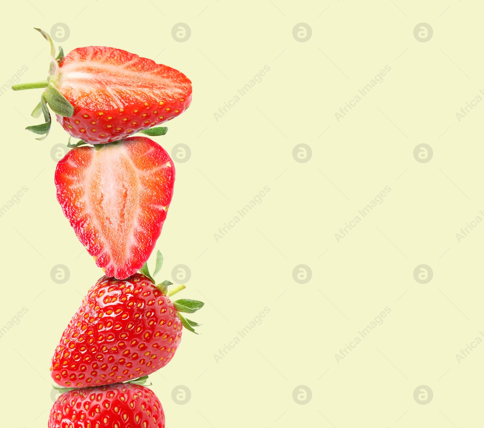 Image of Stack of fresh strawberries on beige background, space for text