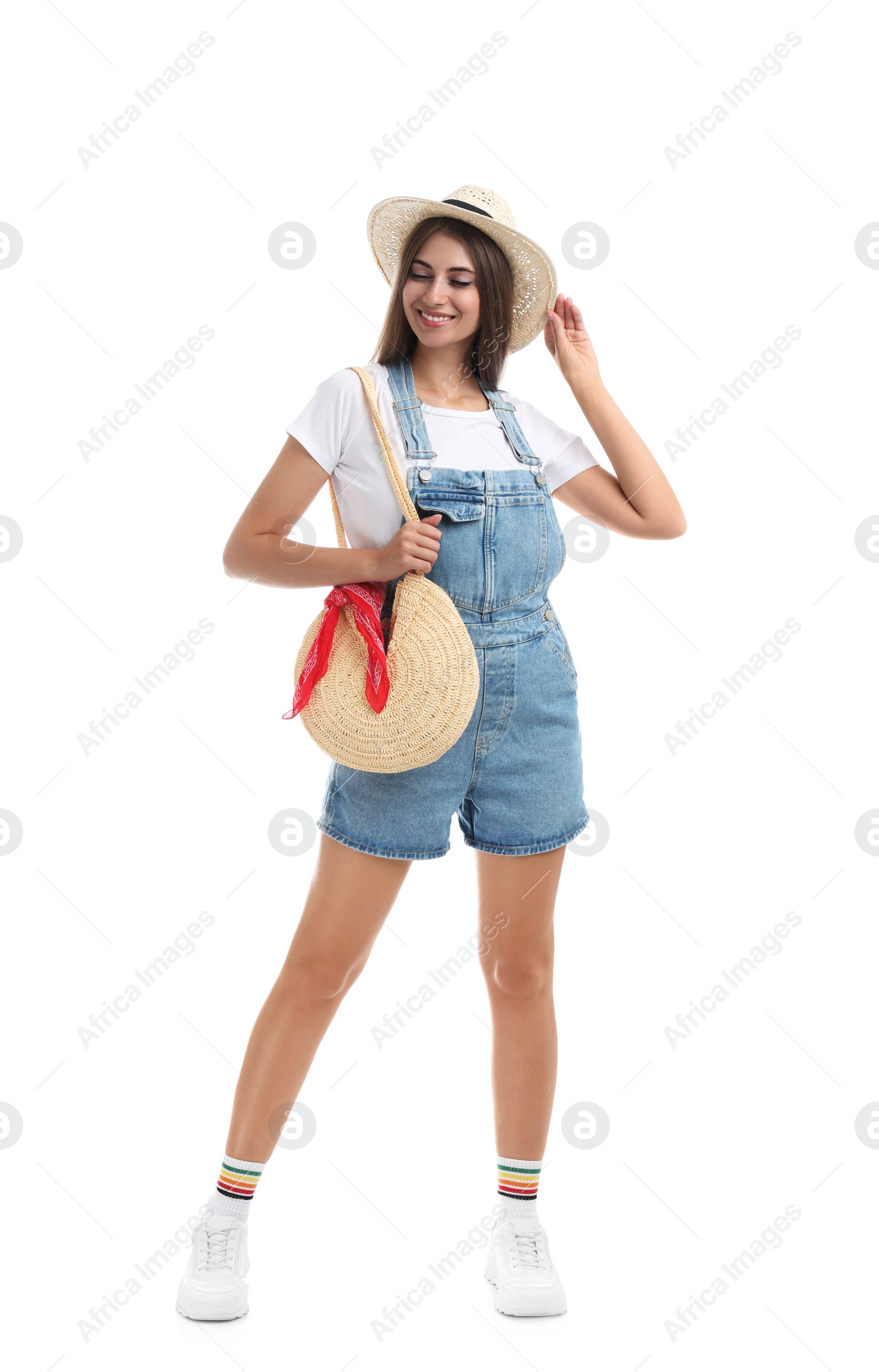 Photo of Beautiful young woman with stylish straw bag on white background