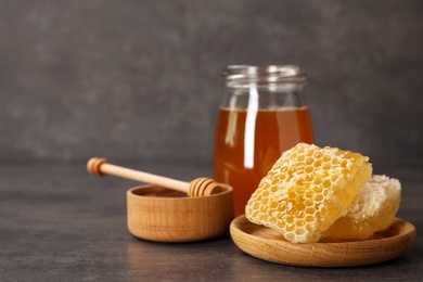 Photo of Composition with tasty fresh honeycombs on table