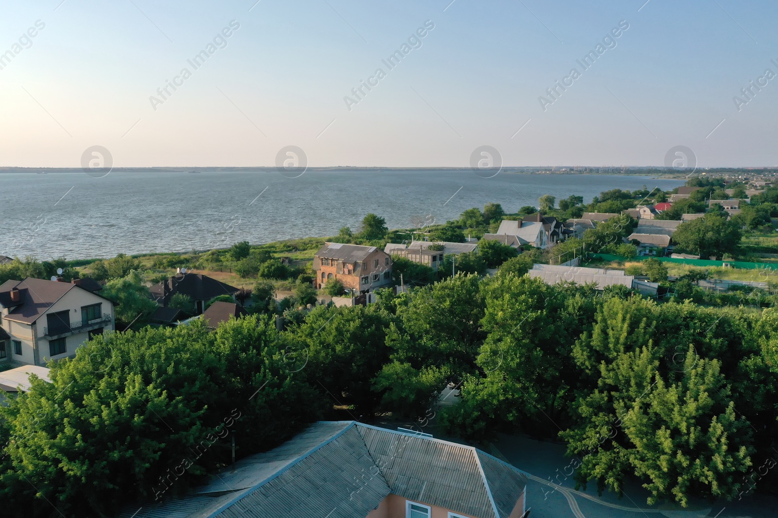 Photo of Beautiful view with cottage houses on river shore