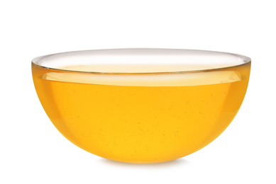 Bowl of organic honey isolated on white
