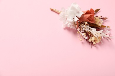 Photo of Stylish boutonniere on pink background, space for text