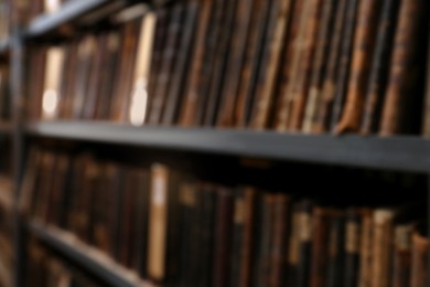 Photo of Blurred view of different books on shelves in library