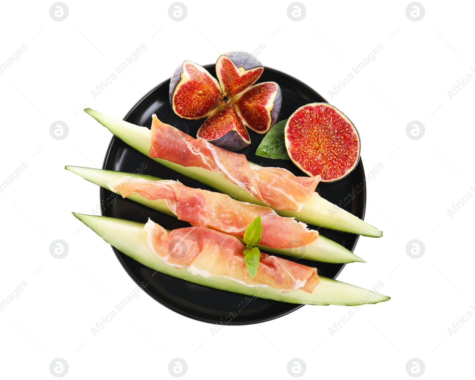 Photo of Plate with tasty melon, jamon and figs isolated on white, top view