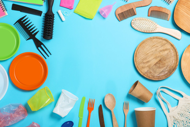 Photo of Flat lay composition with household goods on light blue background, space for text. Recycling concept