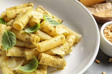 Delicious basil pesto pasta on plate, closeup