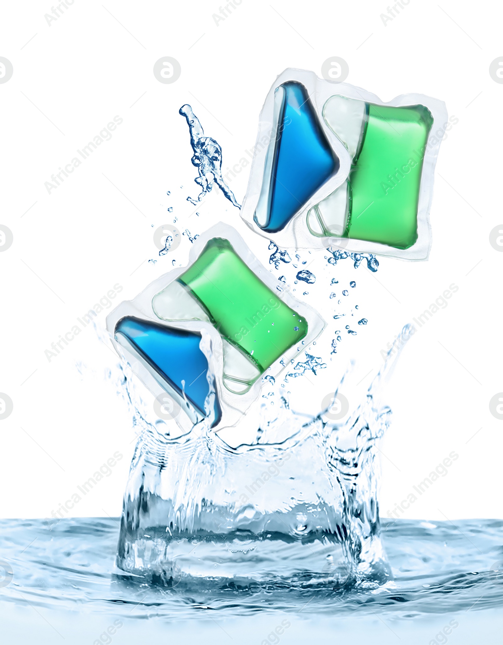 Image of Laundry capsules falling into water on white background. Detergent pods