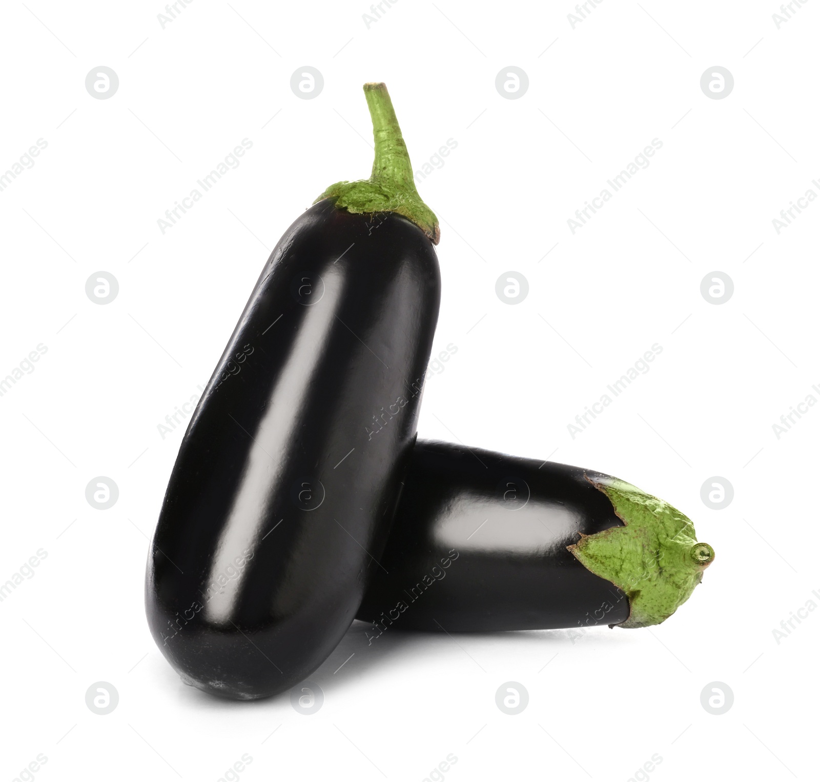 Photo of Tasty raw ripe eggplants on white background