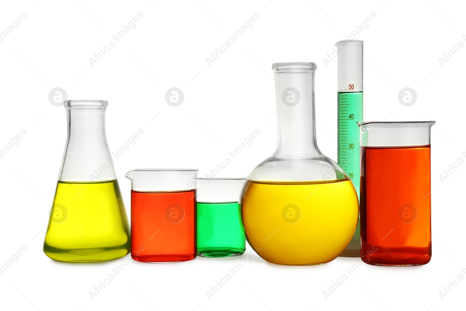 Photo of Laboratory glassware with colorful liquids on white background