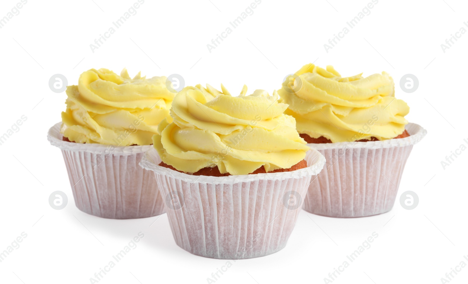 Photo of Tasty cupcakes with cream isolated on white