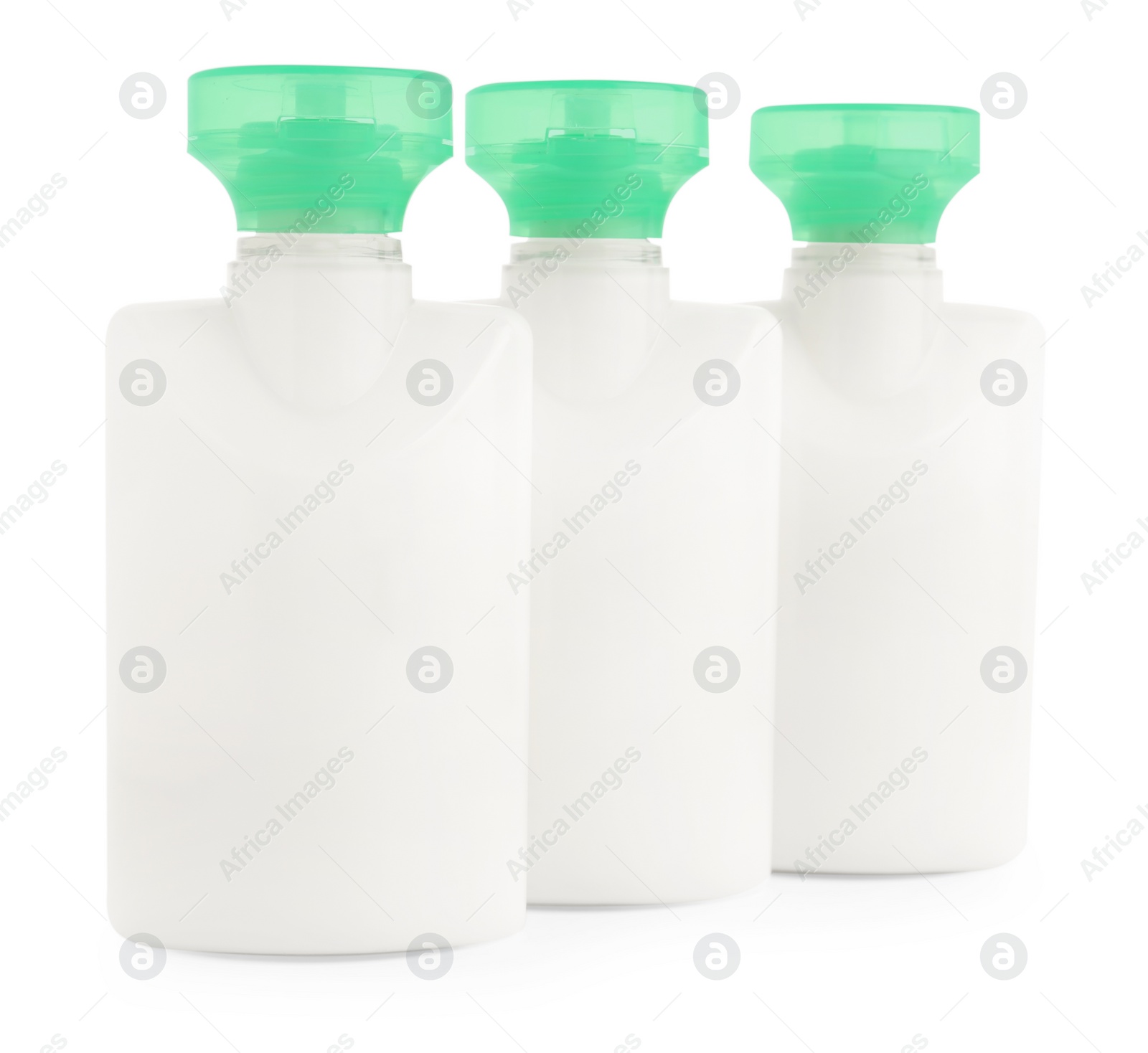 Photo of Mini bottles of cosmetic products isolated on white