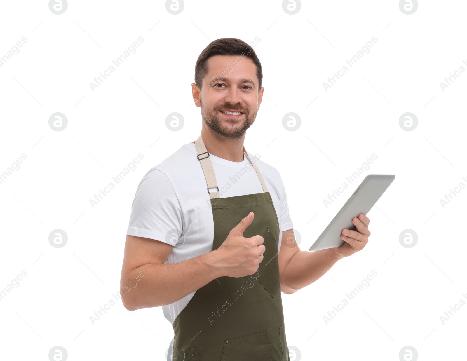 Photo of Smiling man with tablet showing thumb up on white background