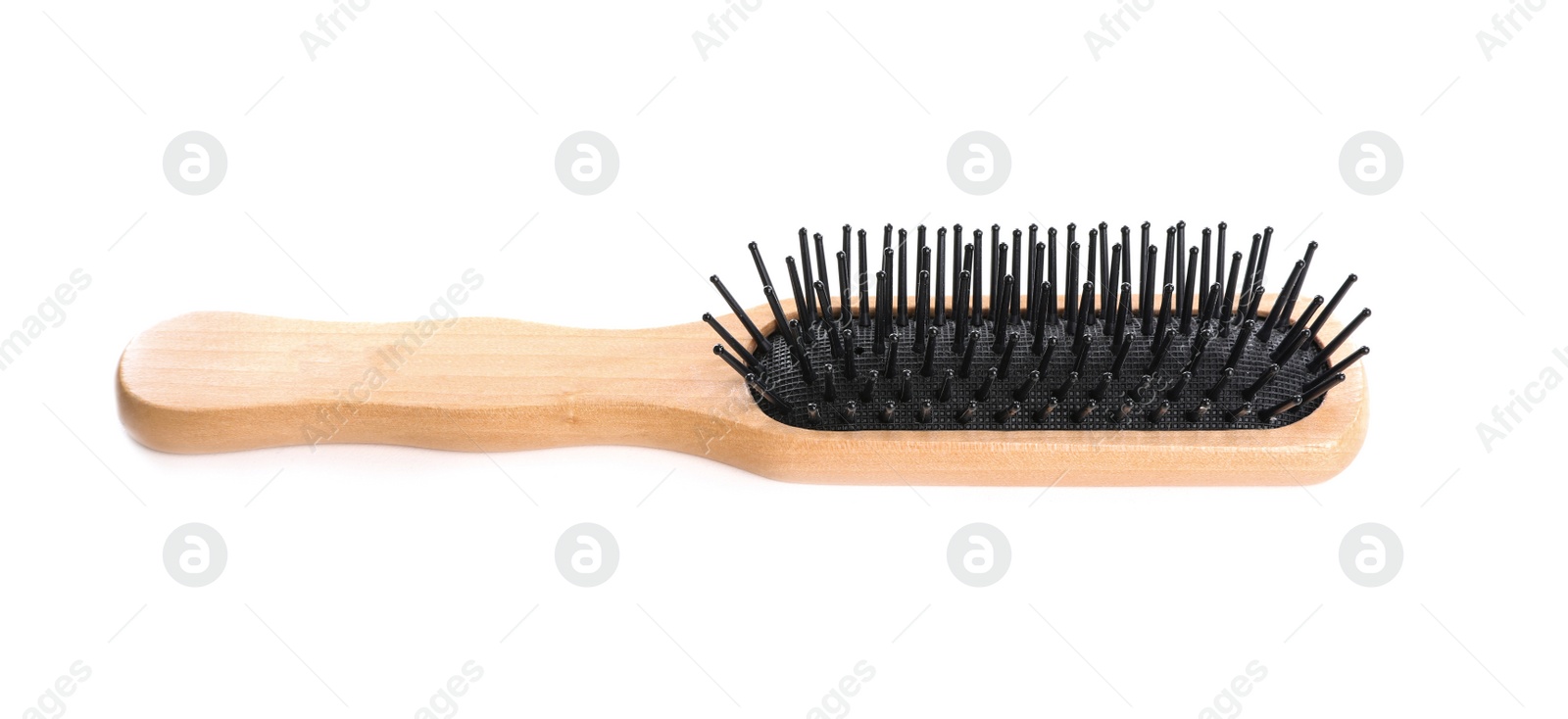 Photo of New wooden hair brush on white background