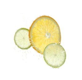 Photo of Slices of citrus fruits in sparkling water on white background