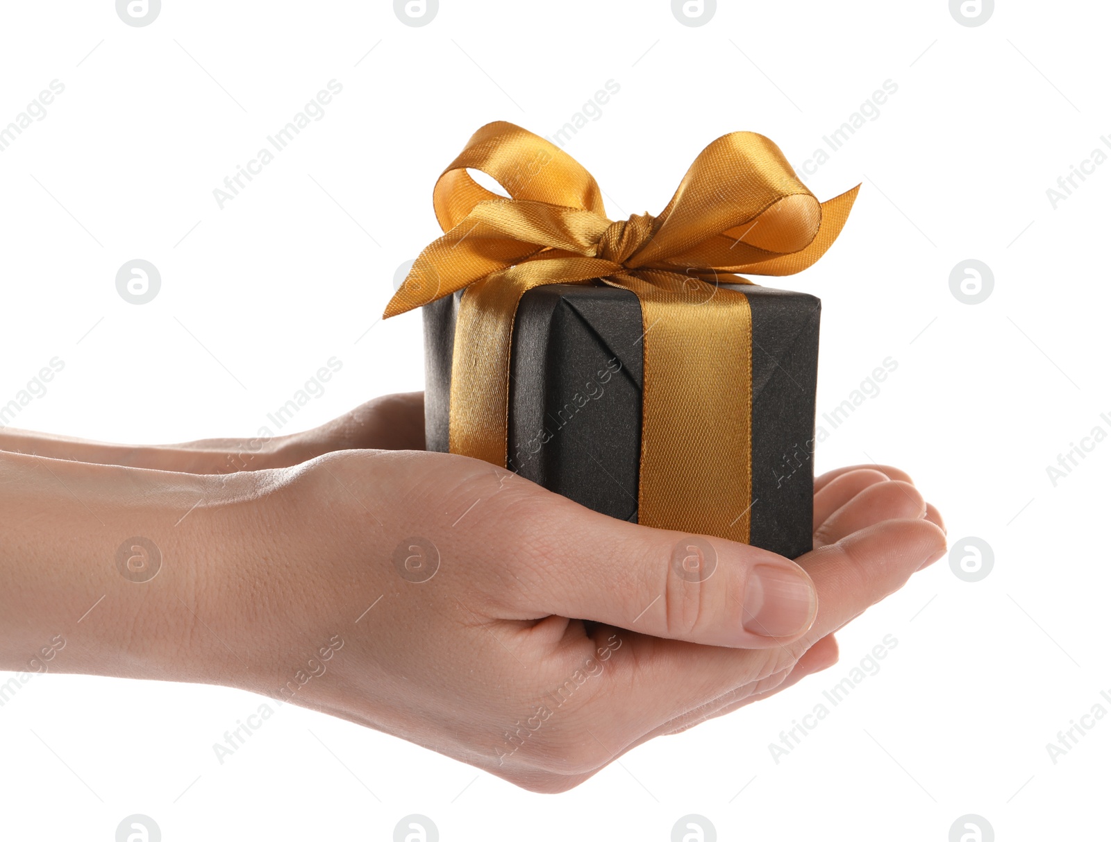 Photo of Woman holding black gift box on white background, closeup