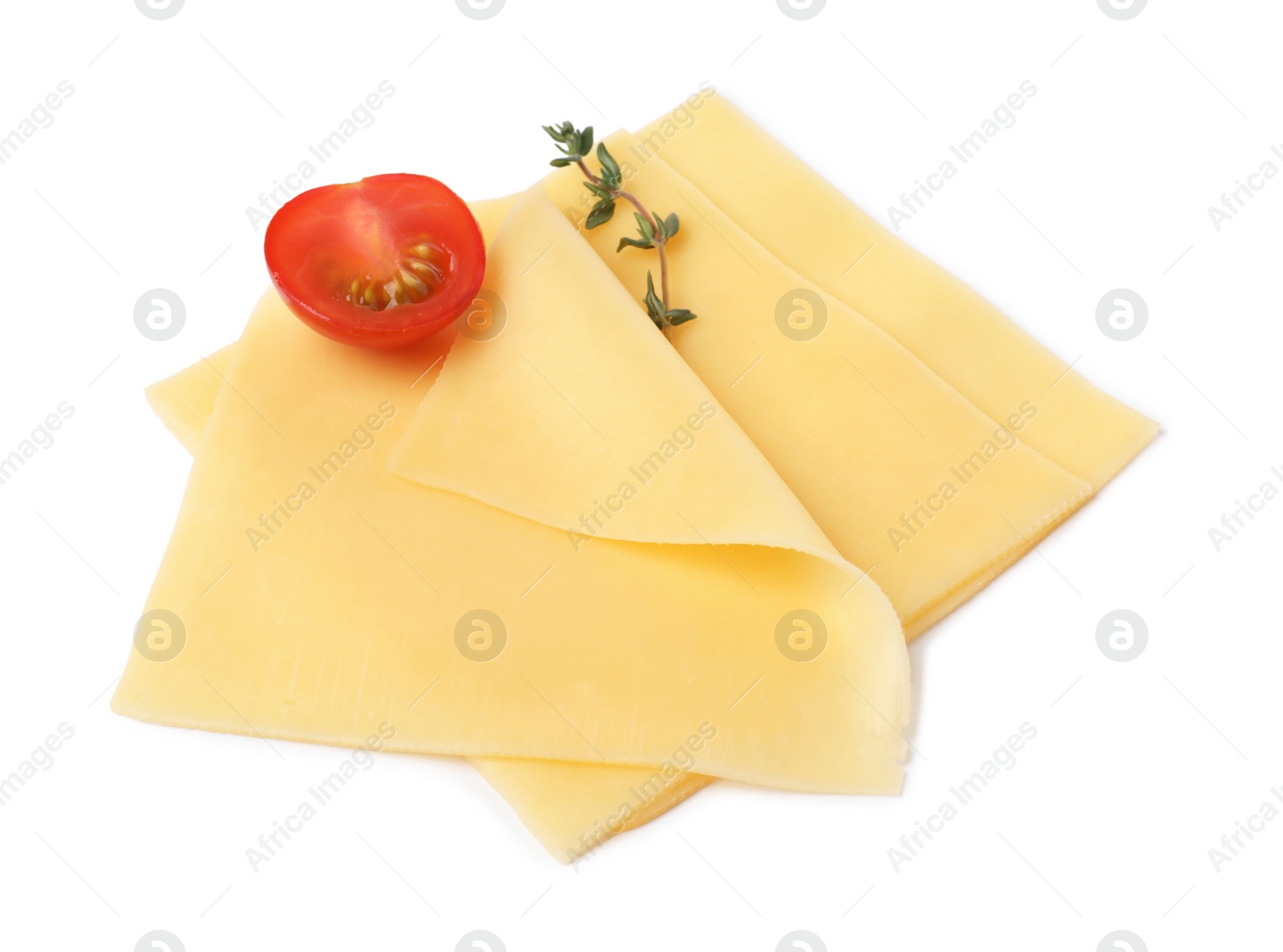 Photo of Slices of tasty fresh cheese, thyme and tomato isolated on white