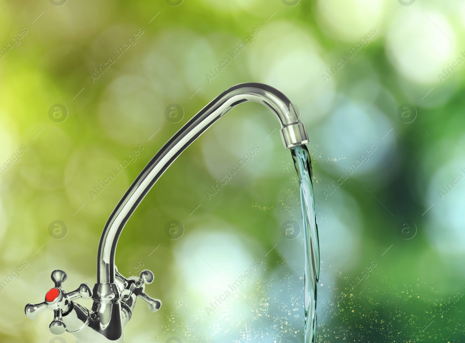 Image of Water flowing from tap outdoors on sunny day, bokeh effect