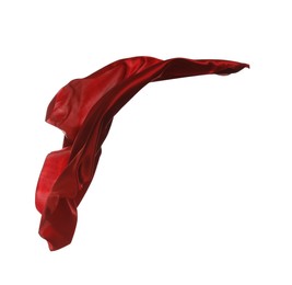 Photo of Beautiful delicate red silk floating on white background