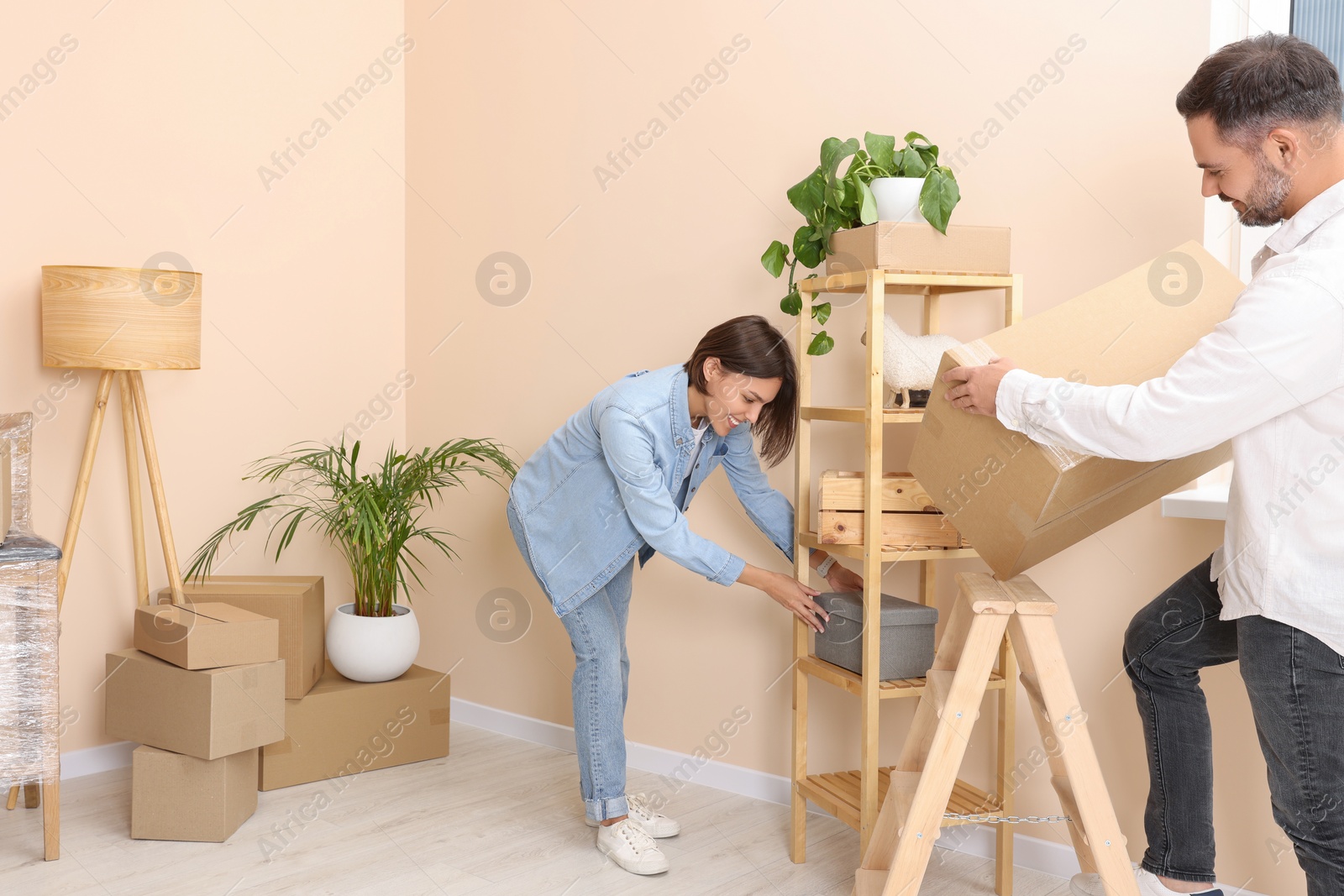 Photo of Happy couple in new apartment. Moving day