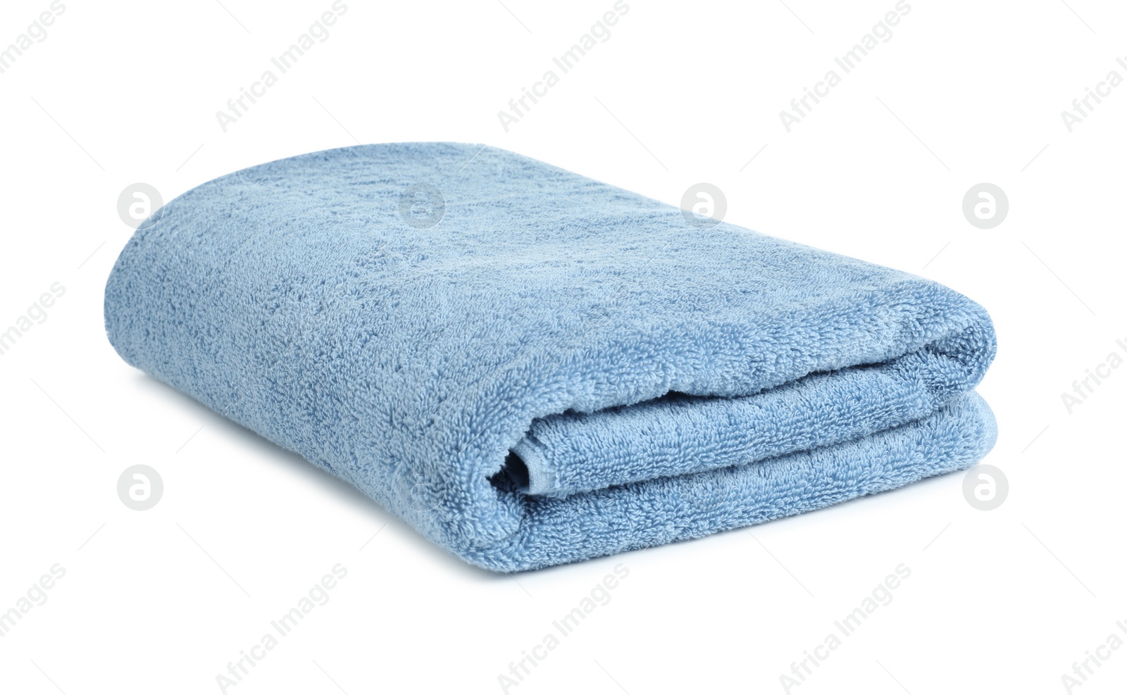 Photo of Folded soft terry towel on white background