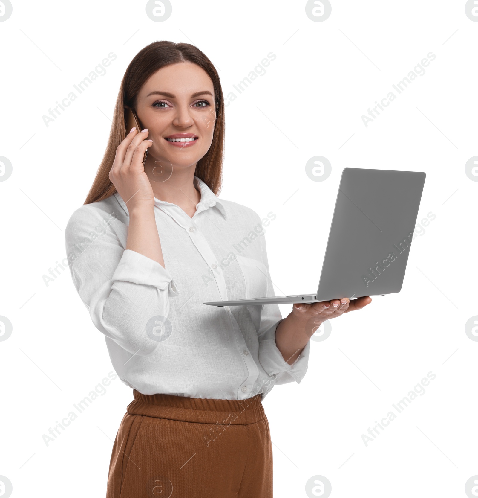 Photo of Beautiful businesswoman with laptop talking on phone against white background