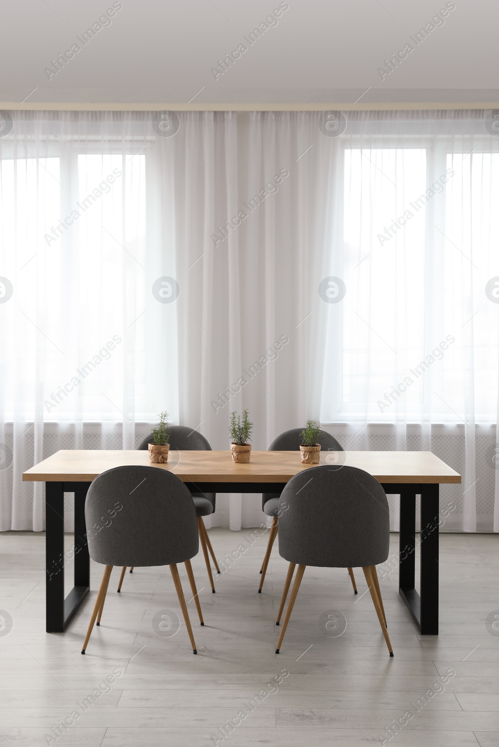 Photo of Modern room interior with chairs and table