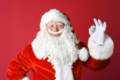 Photo of Portrait of authentic Santa Claus on color background
