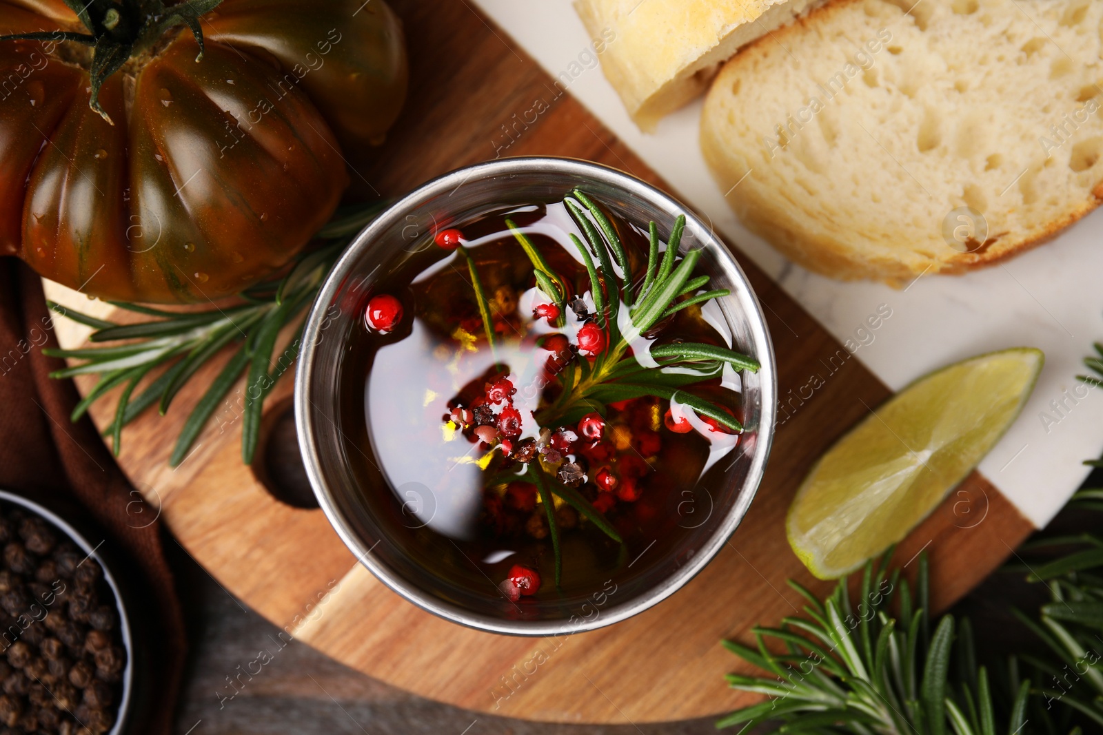 Photo of Tasty marinade and products on wooden table, flat lay