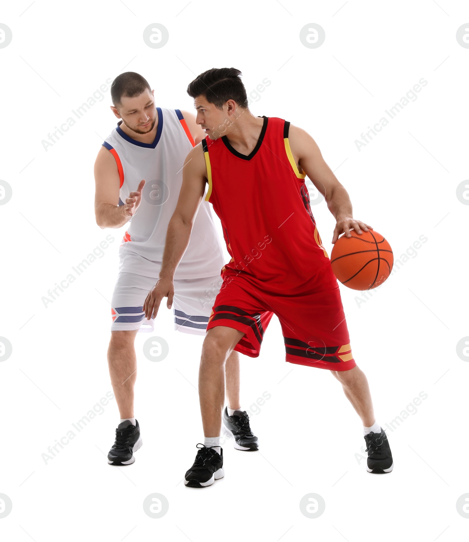 Photo of Professional sportsmen playing basketball on white background