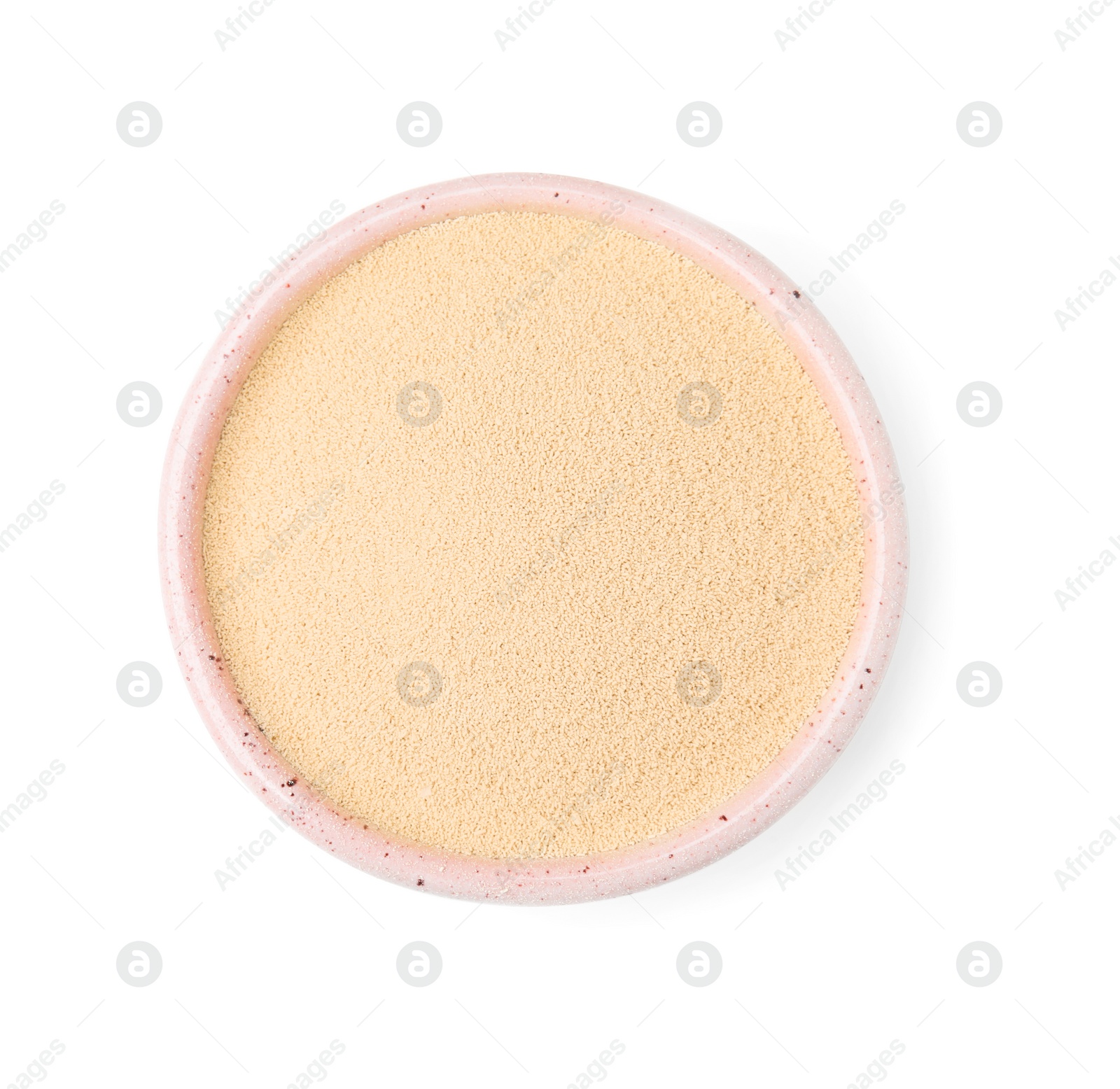 Photo of Granulated yeast in bowl isolated on white, top view