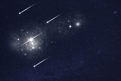 Image of Shooting stars in dark sky at night