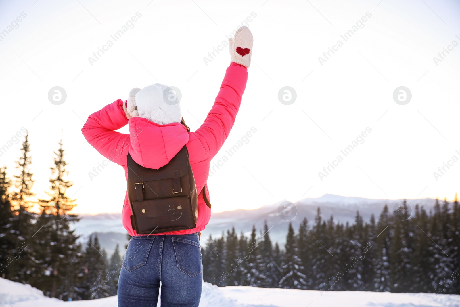 Photo of Young woman outdoors, space for text. Winter vacation