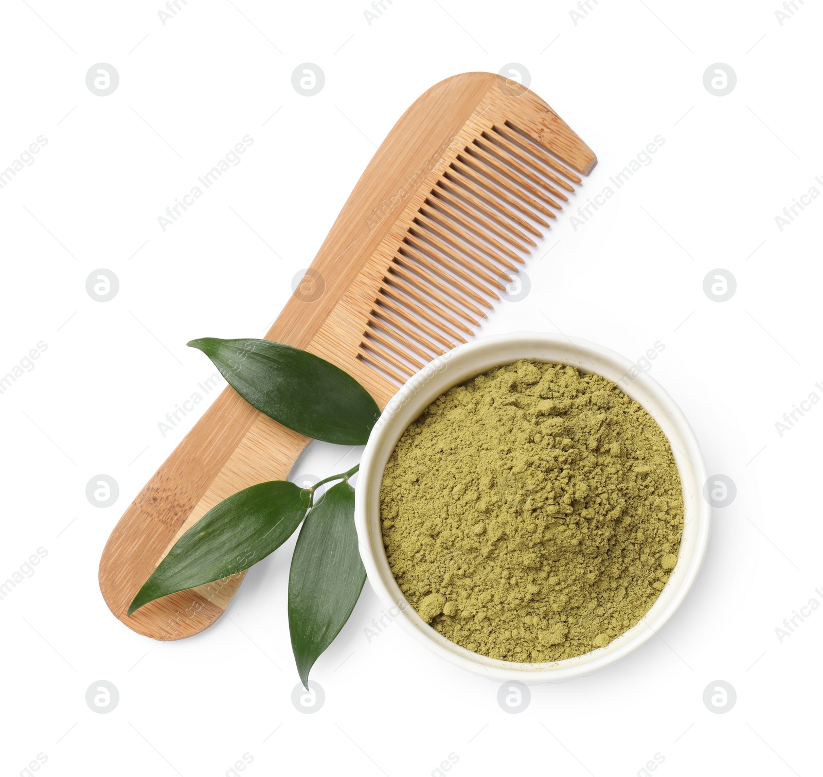 Photo of Henna powder in bowl, comb and green leaves isolated on white, top view