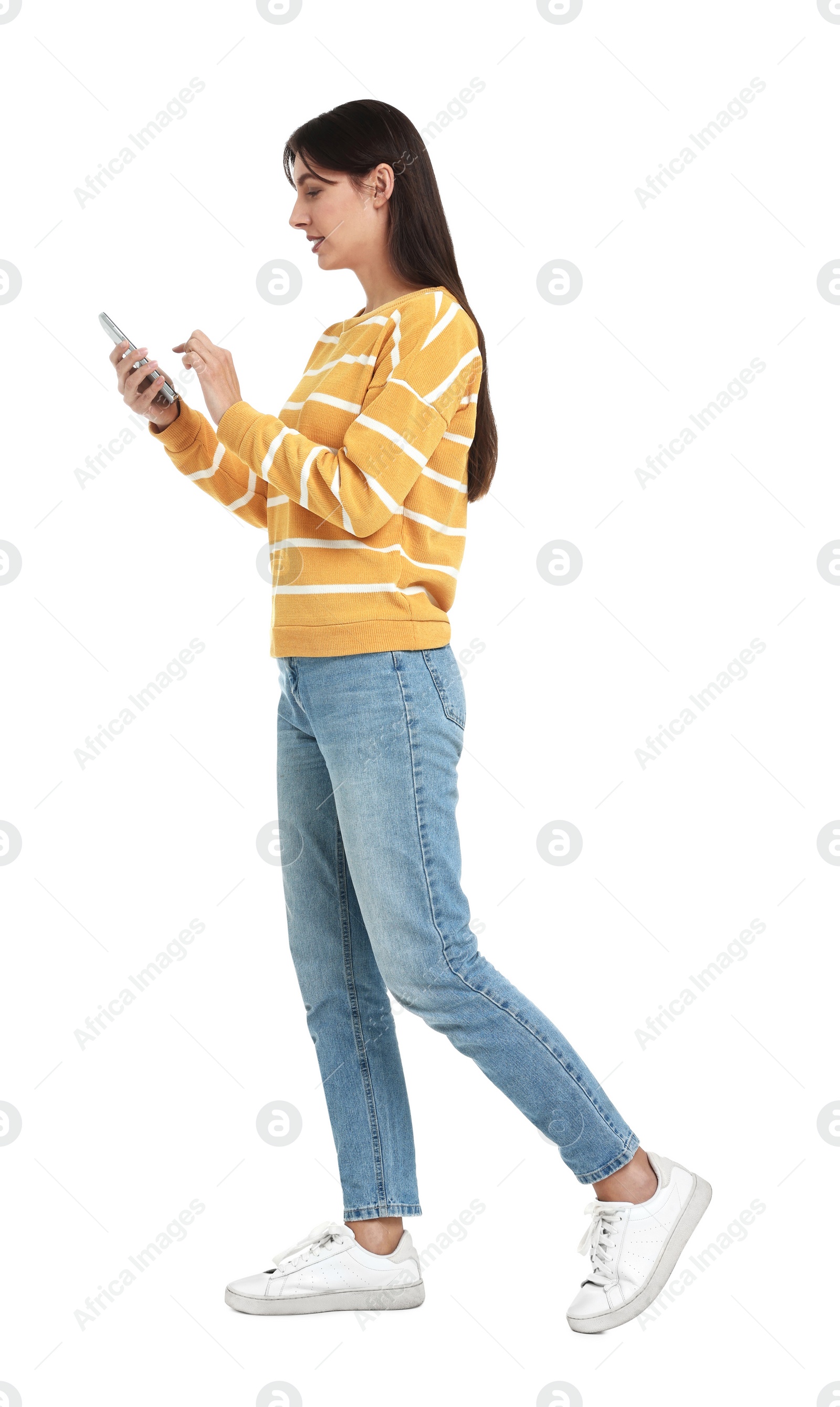 Photo of Young woman using smartphone on white background