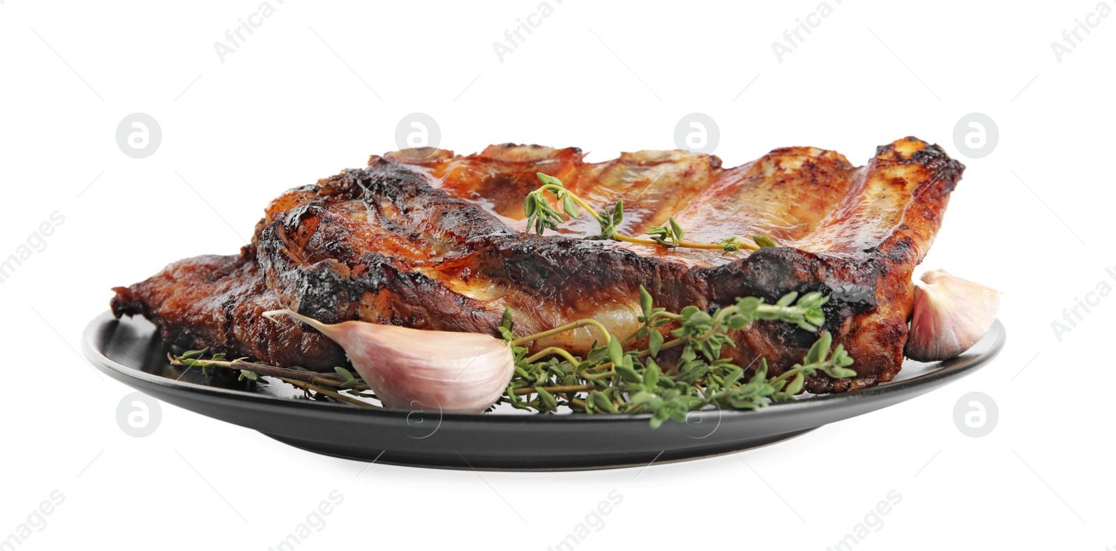 Photo of Tasty grilled ribs with thyme and garlic isolated on white