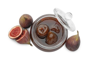 Jar of tasty sweet jam and fresh figs isolated on white, top view