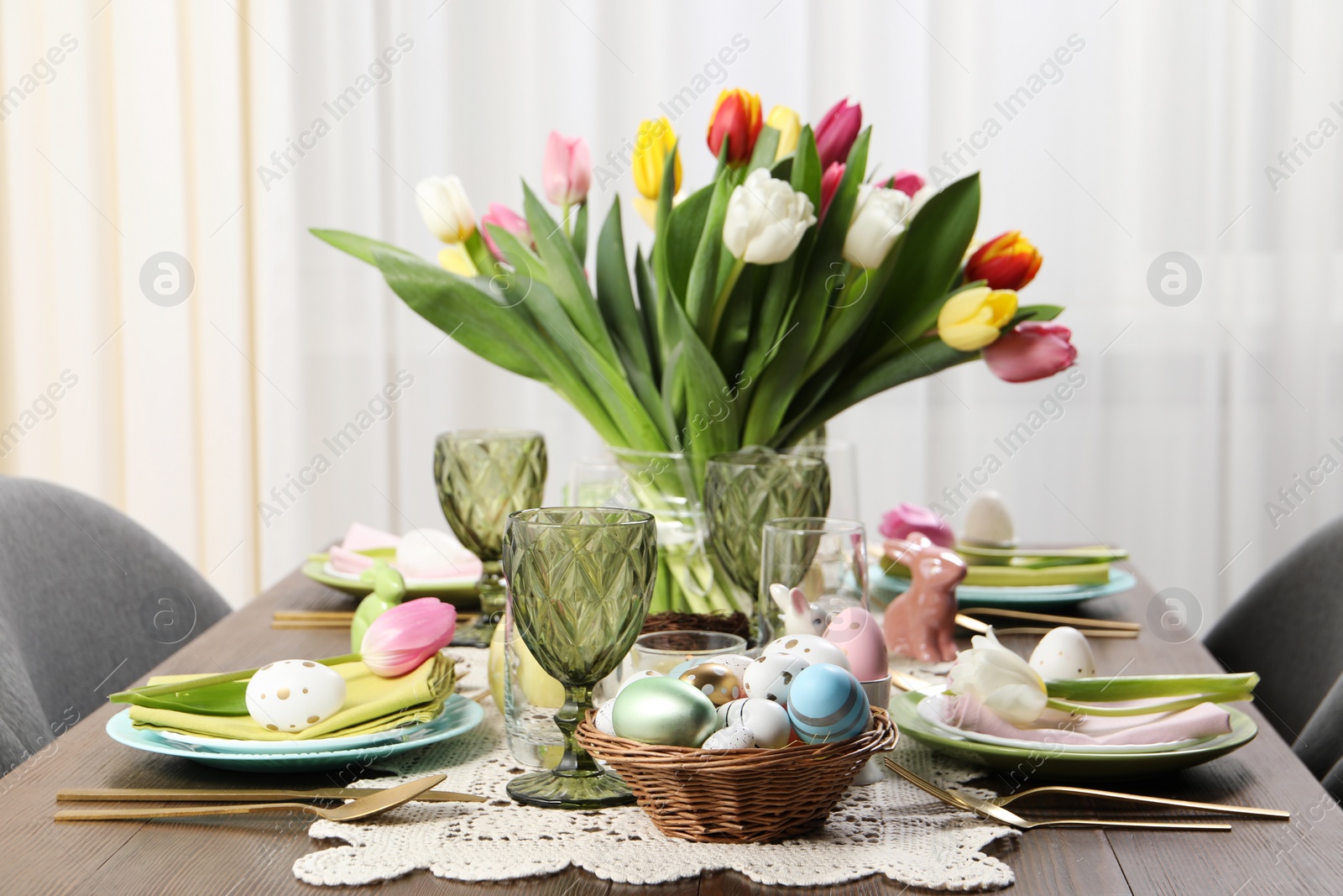 Photo of Festive table setting with beautiful flowers. Easter celebration