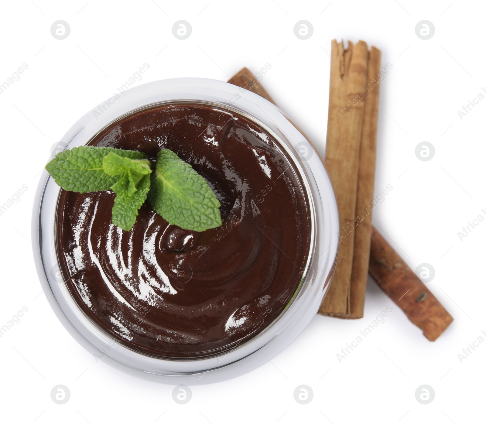 Photo of Glass of delicious hot chocolate with fresh mint and cinnamon sticks on white background, top view